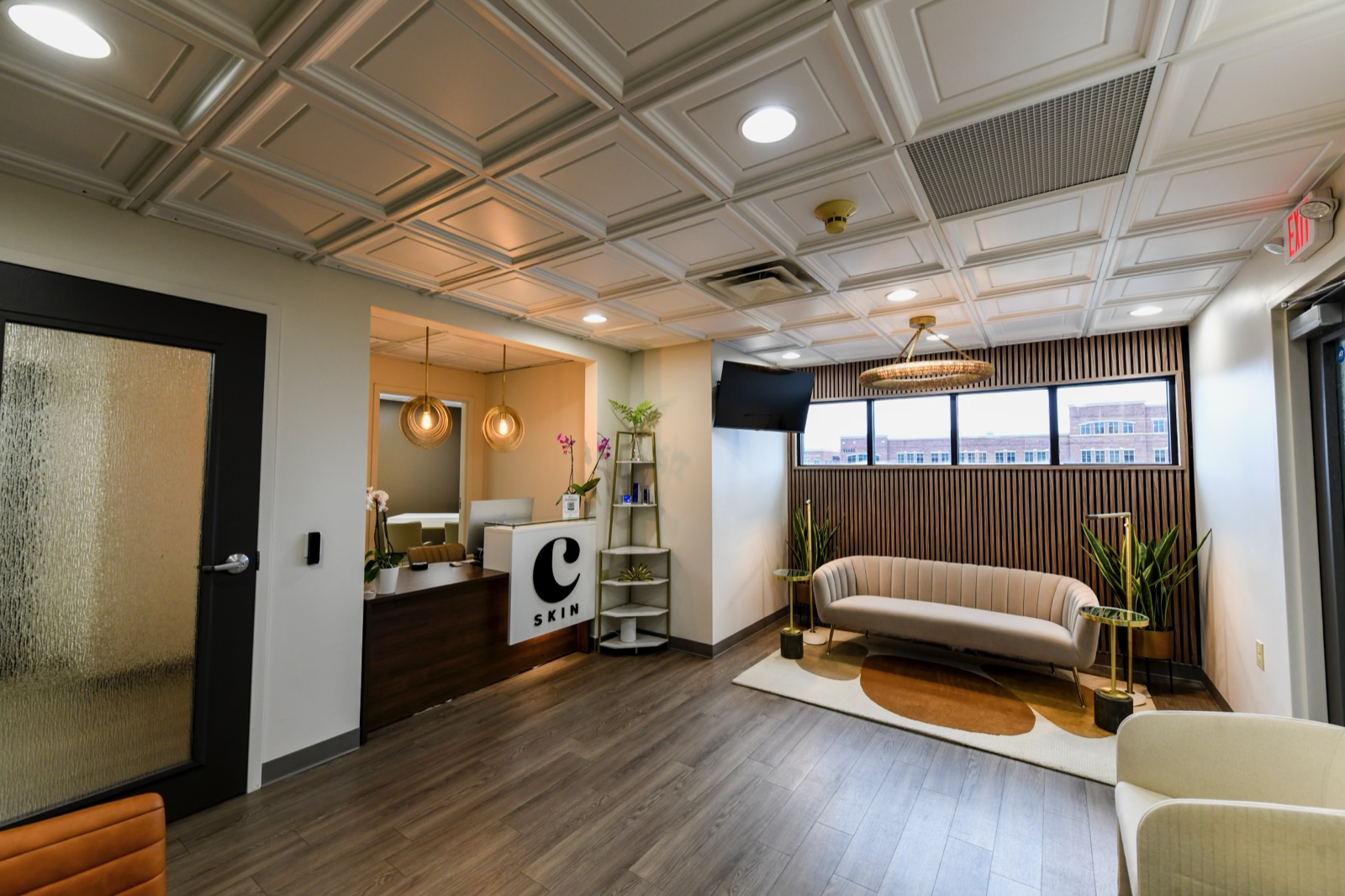 The Choosi lobby seen from the entry, with the window band, sofa, and reception nook