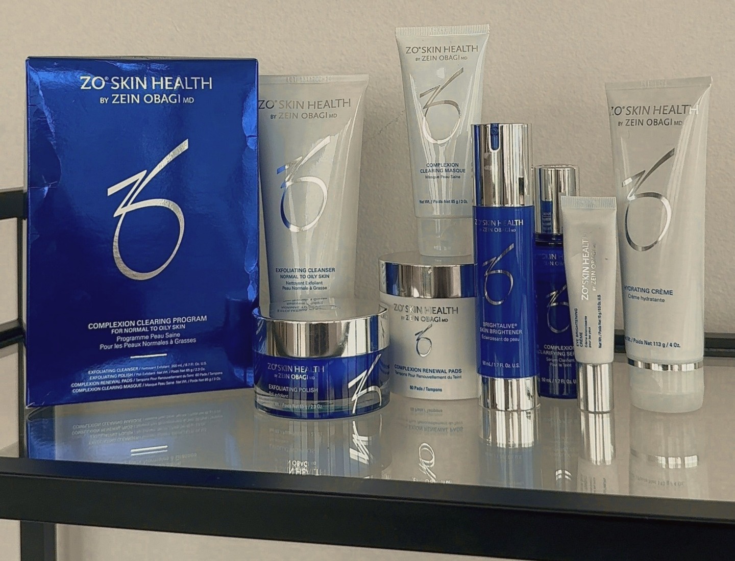 Skincare lined up on the glass retail shelf in the Choosi lobby